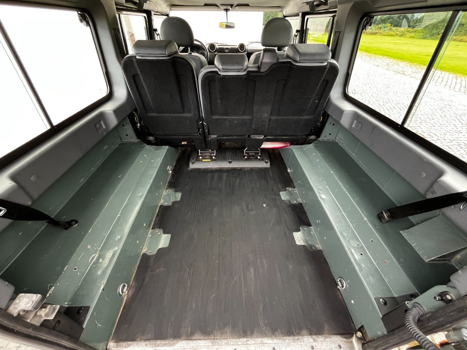 Grøn Land Rover Defender 110 fra 2013