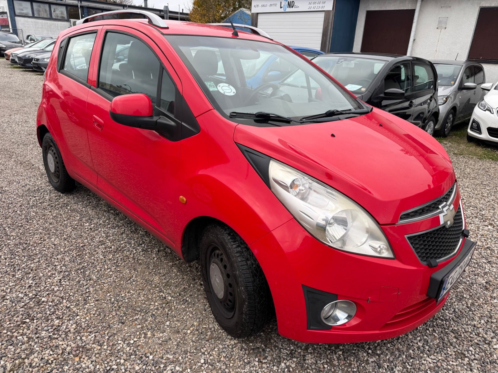 Rød Chevrolet Spark fra 2011