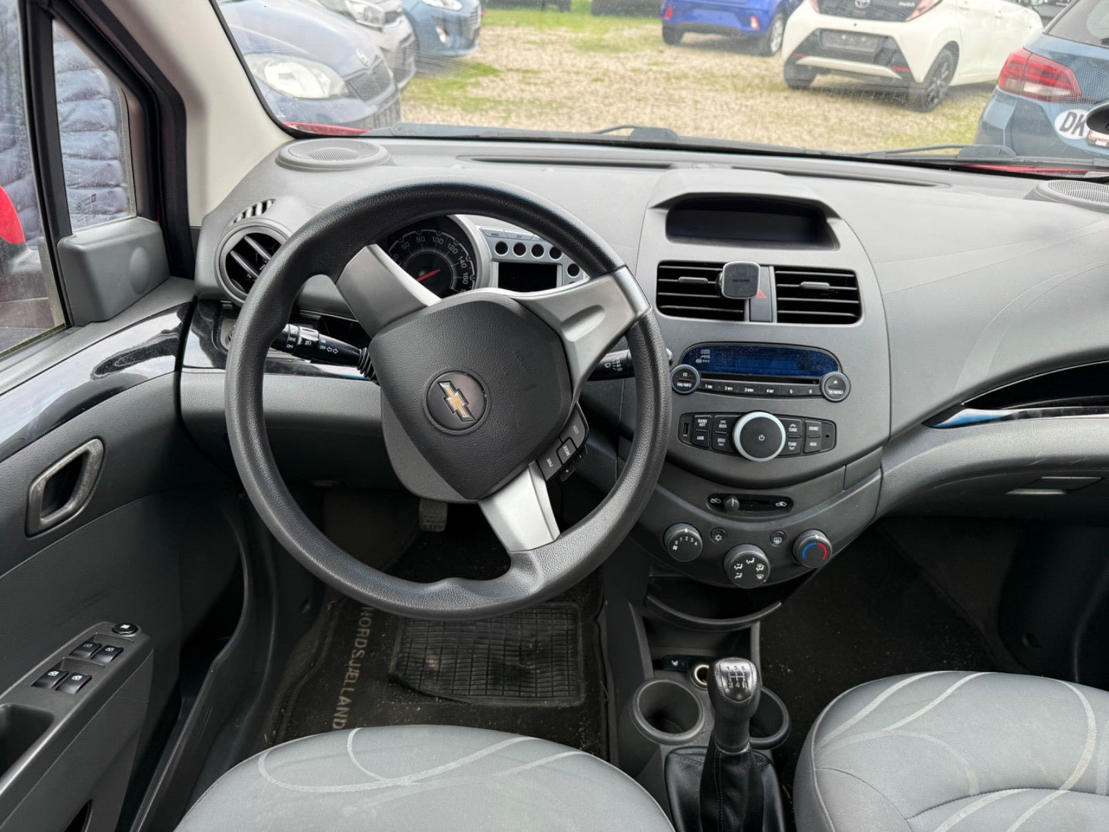 Rød Chevrolet Spark fra 2011
