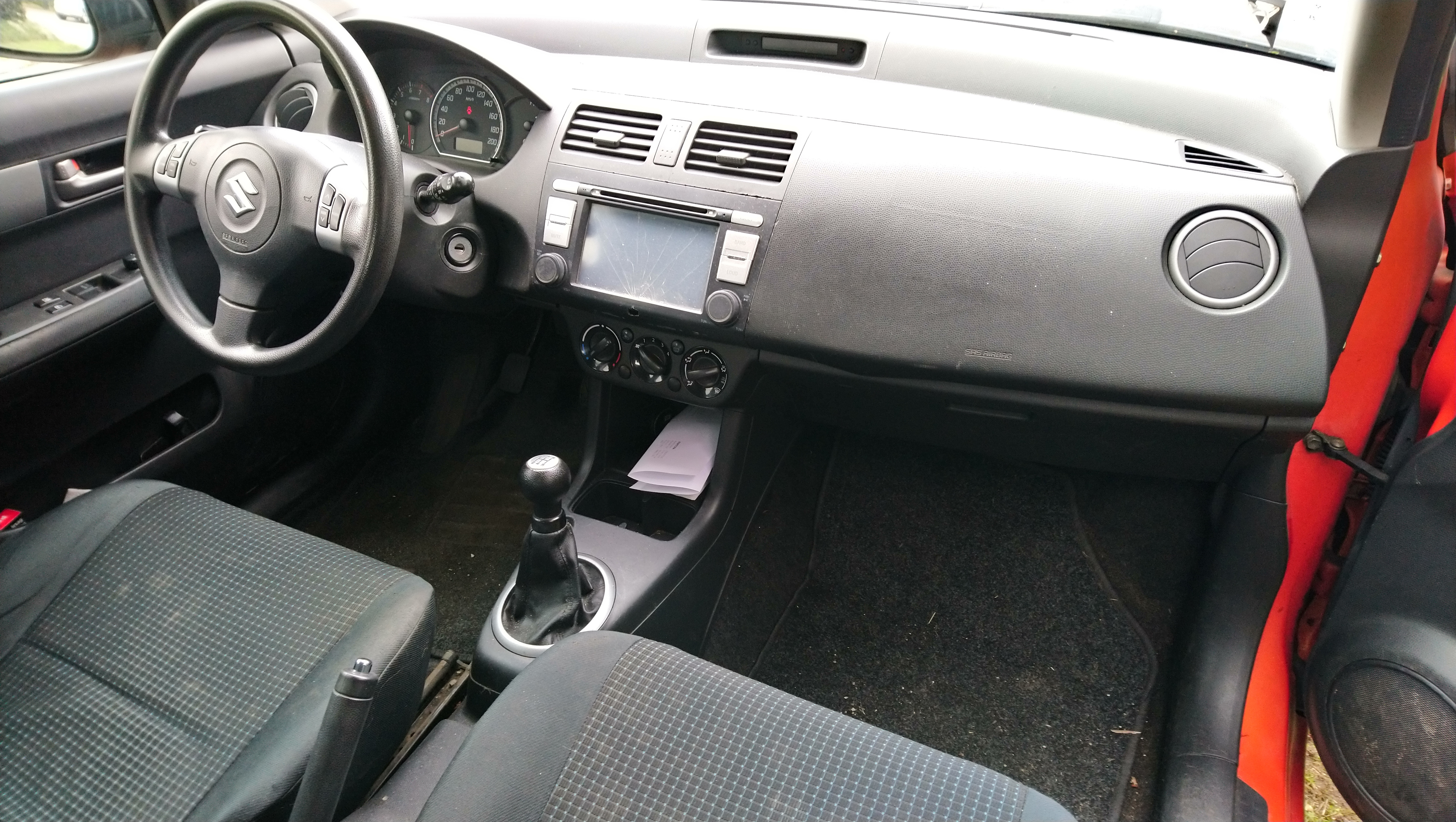 Orange Suzuki Swift fra 2005